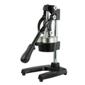 Black and white manual cast iron citrus juicer with stainless steel strainer, 40cm tall.