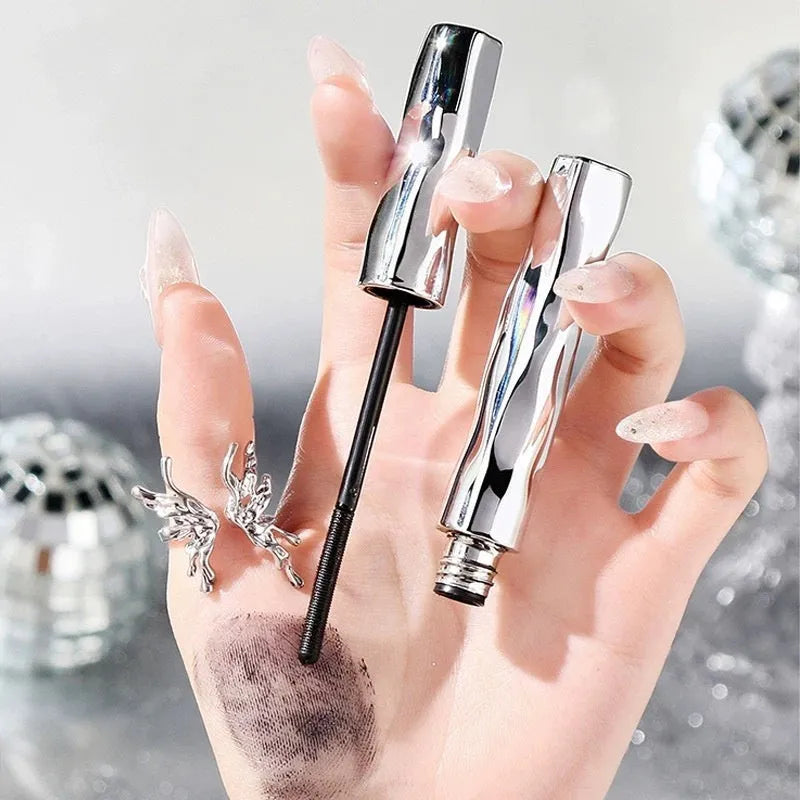 Waterproof mascara with steel tube and brush, shown in black and brown colour options, some sets include an eyelash curler.