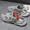 Men's grey EVA coconut slippers with closed toe and perforated holes for beach use