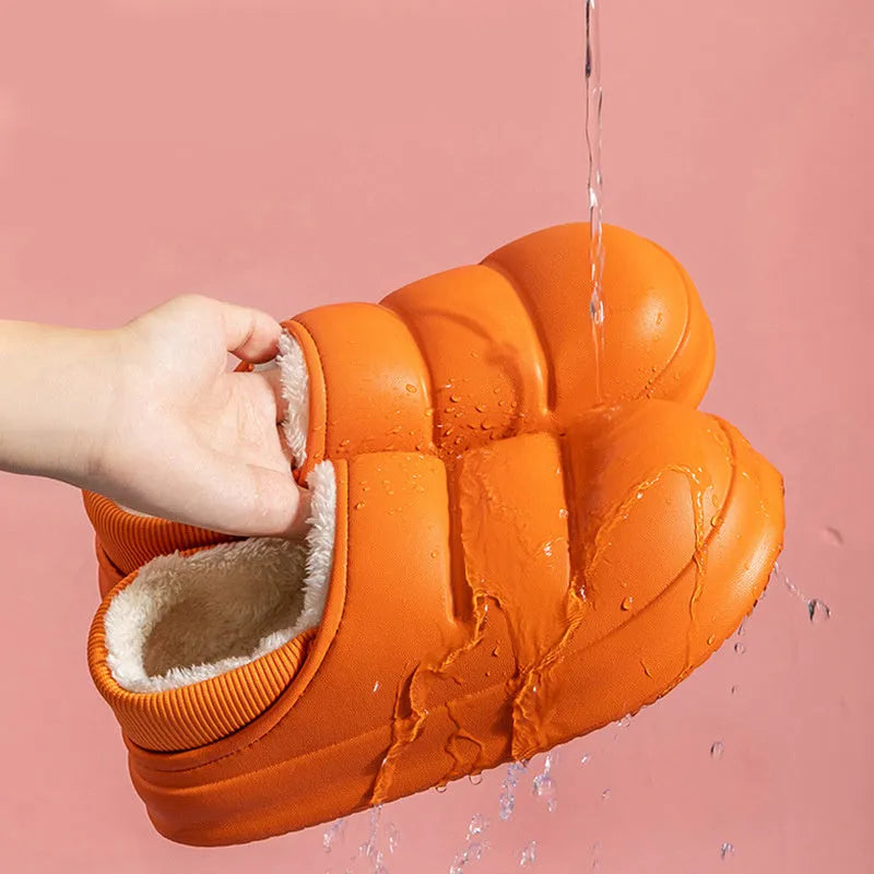 Waterproof EVA garden slippers in green with a plush lining and non-slip sole.