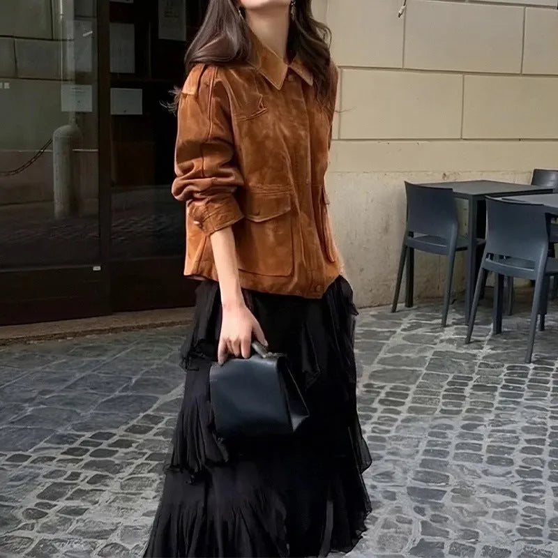 Women's longline brown suede-look polyester coat on a hanger, showing regular sleeves.
