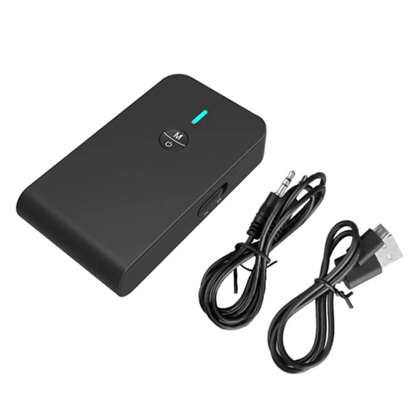 A black Bluetooth audio adapter with a 3.5mm AUX plug and external power cable.
