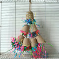 Natural wood-coloured palm weaving parrot gnawing toy in a paper cup shape, hanging.