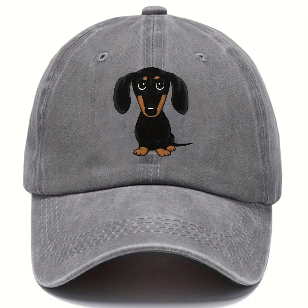 Retro washed blue cotton baseball cap with a machine-embroidered brown Dachshund dog graphic on the front.