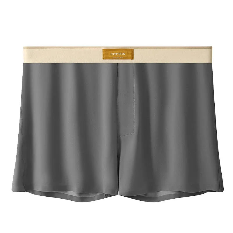 Three pairs of men's solid colour ice silk briefs on a grey background.