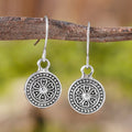 Round geometric earrings with distressed ethnic print in electroplated zinc alloy