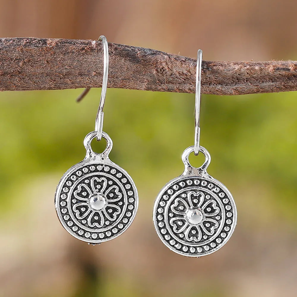 Round geometric earrings with distressed ethnic print in electroplated zinc alloy