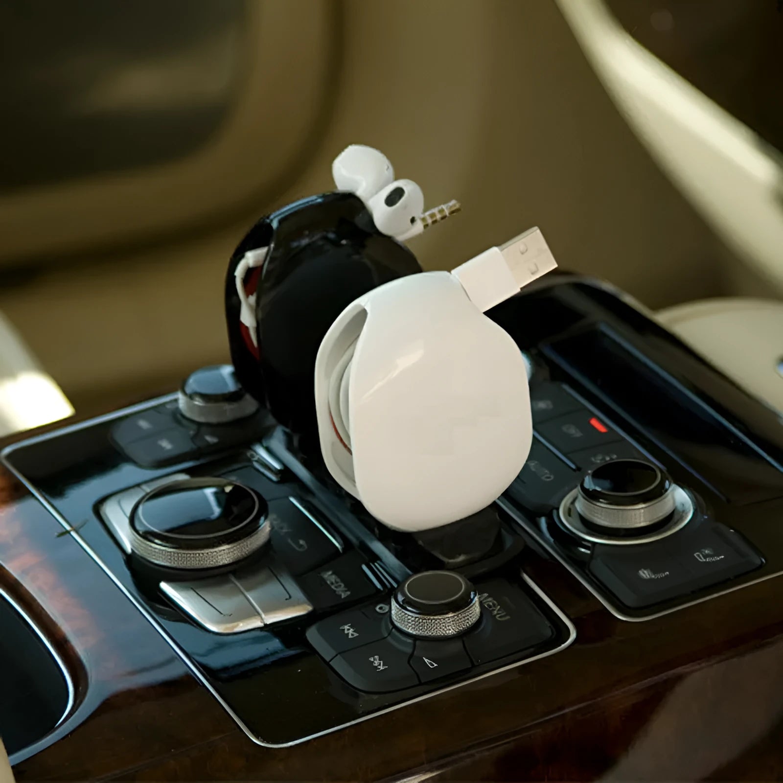 Automatic earphone cable winder retractor in various colours on a white background.