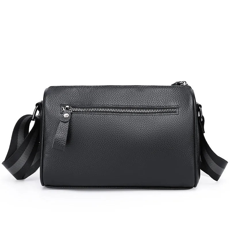 Black genuine leather one-shoulder crossbody bag showing front view and adjustable strap.