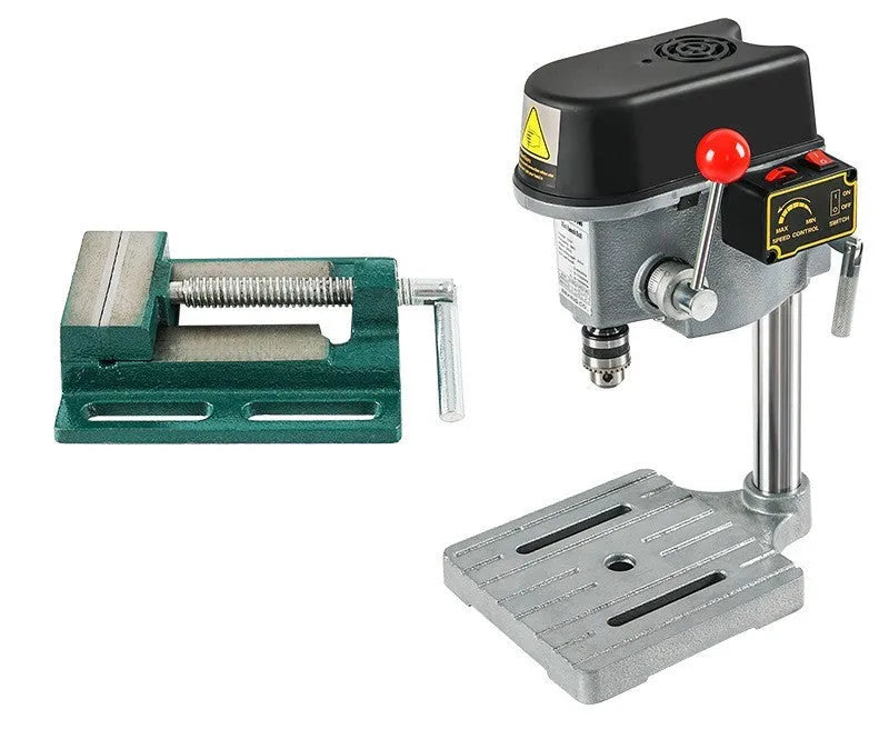 Mini bench drill and milling machine on a workbench with cross bench pliers.