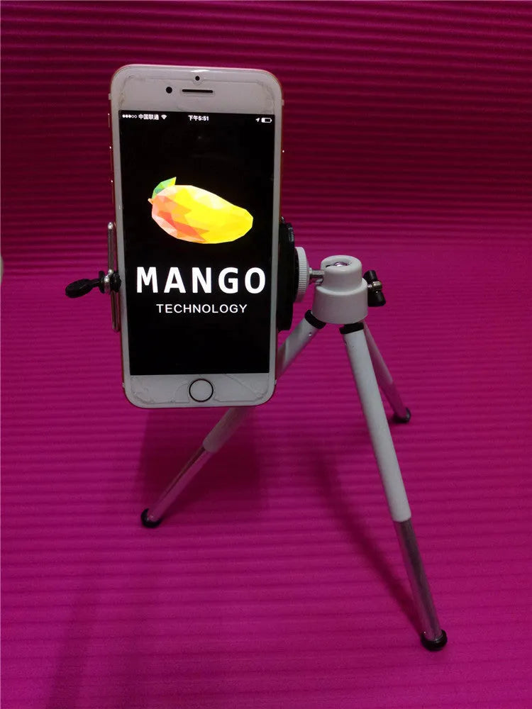 Black desktop phone holder with two-section bracket arm on wooden desk