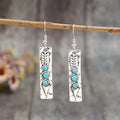 Long geometric silver earrings with turquoise inlays, zinc alloy construction