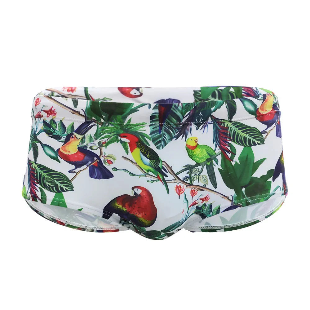 Men's floral bird print nylon swim trunks in boxer style on white background