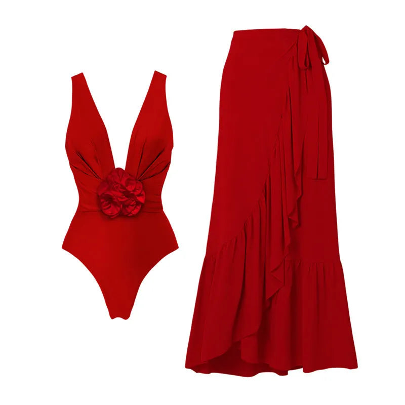 Red women's V-neck halter swimsuit with detachable flower and matching long skirt on a white background.