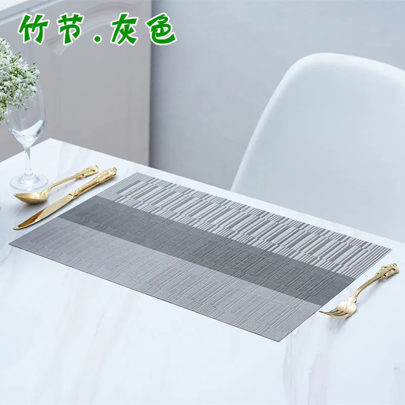 Modern PVC non-slip dish mat in gradient bamboo pattern placed in a kitchen sink.