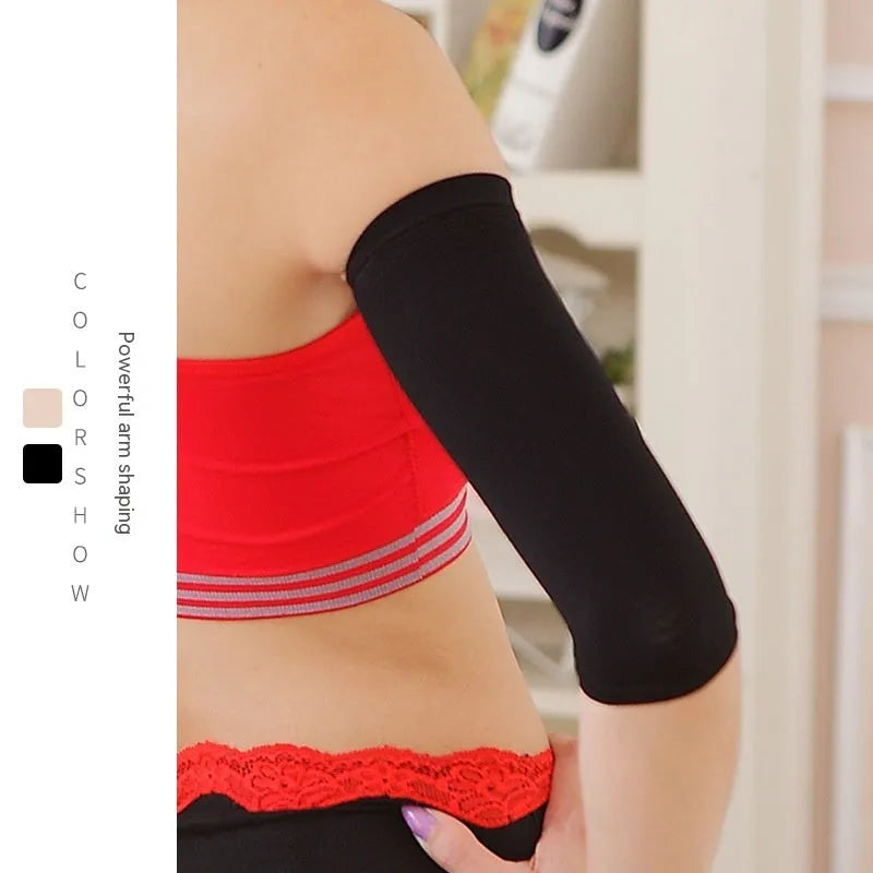 Women's black and skin tone nylon shaping arm sleeves laid flat, free size.