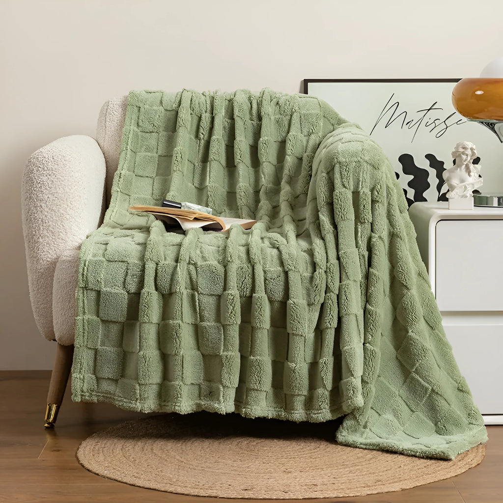 Geometric pattern polyester fleece blanket in creamy white colour showing thickened texture