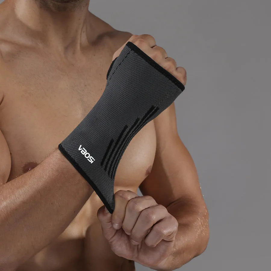 Adult wristband wrist guard for tennis in black, green or orange, single pack, sizes L M XL