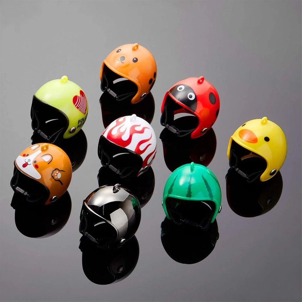 Small hard plastic helmet for chicken or bird with elastic straps and sponge lining.