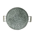 Round wrought iron storage tray in two sizes on a wooden surface.