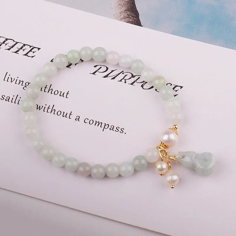 Women's jade bracelet with natural emerald jade insets and gourd design in Chinese style