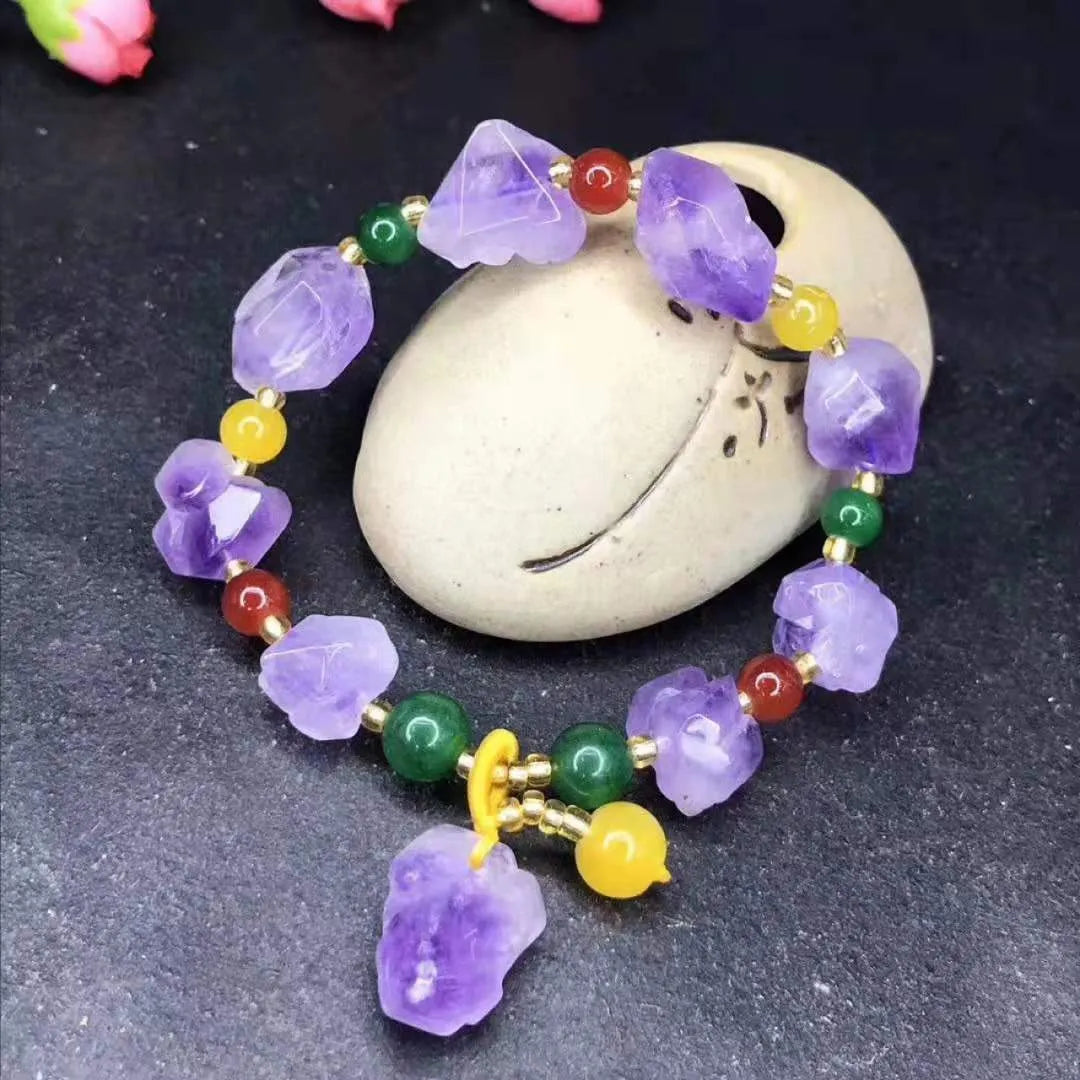 Women's amethyst bead bracelet with natural-shaped stones and fu character charm on adjustable beaded design