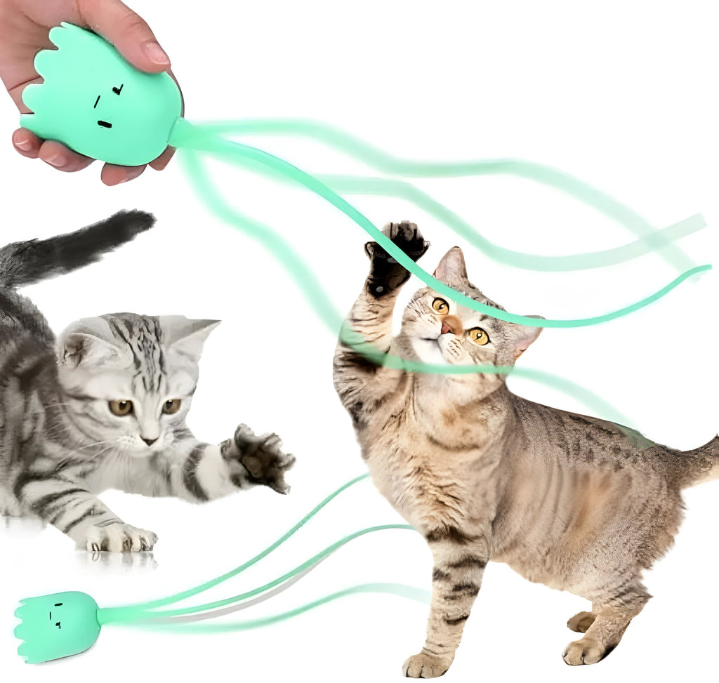 Green automatic cat wand toy with a swinging silicone tail on a white background.