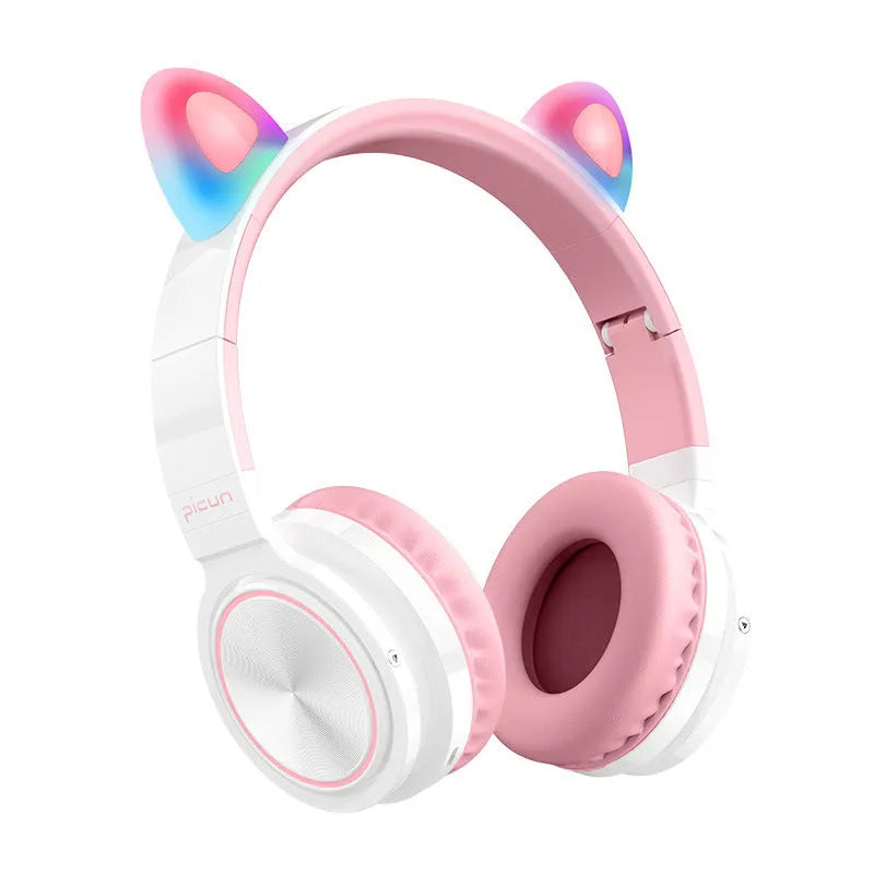 Pink and white wireless Bluetooth over-ear headphones with protein ear cushions and braided charging cable