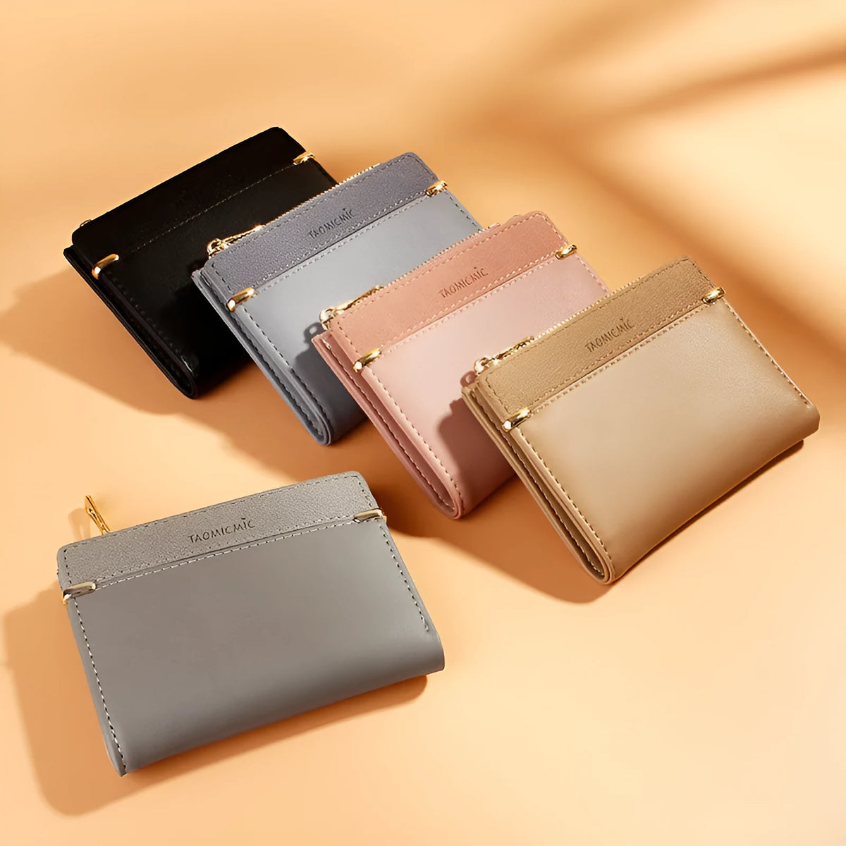 Compact ladies wallet showing multiple internal compartments with zipper closure in various colour options