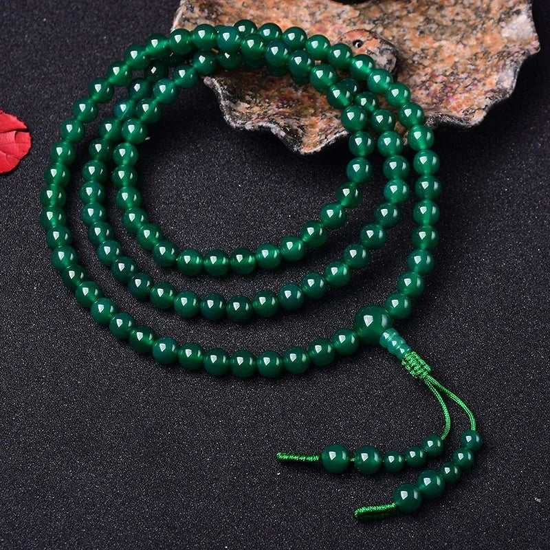 Handmade natural green agate 108-bead bracelet with Thangka pendant on wrist