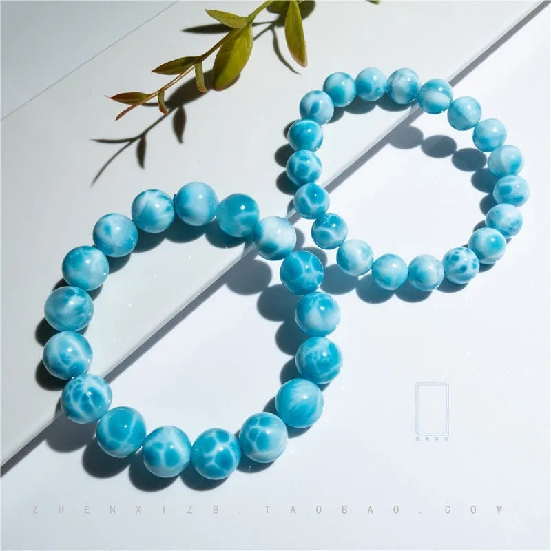 Blue bodhi bracelet with sea-pattern crystal stone and pearl accents in Maillard style.