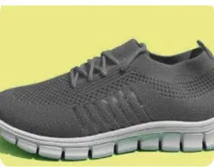 Women's breathable flying knit sports flats in beige with mesh upper and front lace tie.