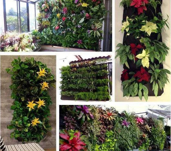 Green felt vertical wall planter with multiple pockets hanging on an outdoor wall
