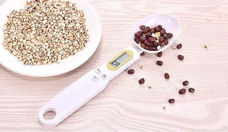 Electronic measuring spoon scale with digital display showing weight measurement