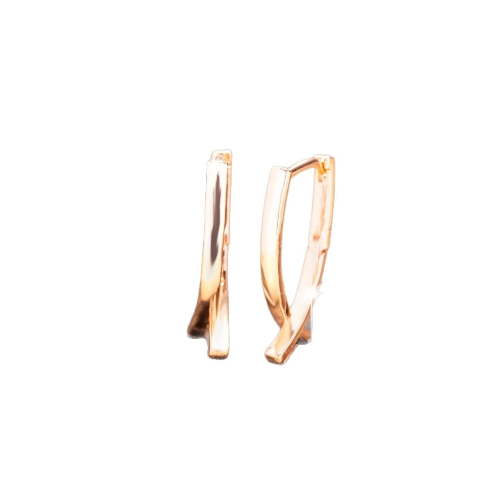 Rose gold cross shaped copper earrings with minimalist design and light luxury finish
