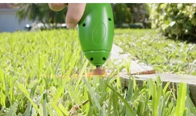 Cordless lawn trimmer with extension pole and protective shield for garden maintenance