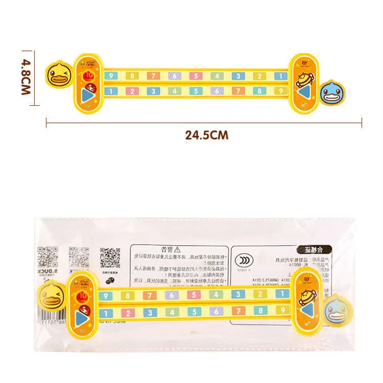 Yellow plastic children's digital decomposition ruler with cartoon graphics, showing 24.5 cm length.