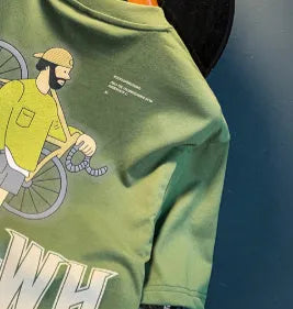 Green loose fit men's t-shirt with trendy printed design on short sleeves.