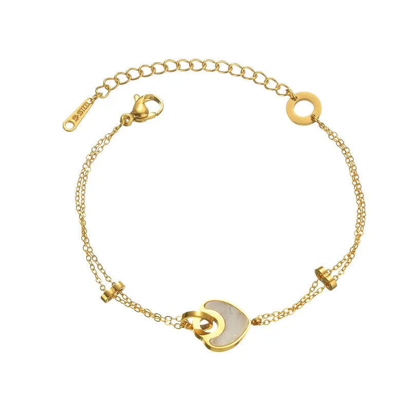 Women's stainless steel bracelet with electroplated finish and a double-layered resin heart charm.
