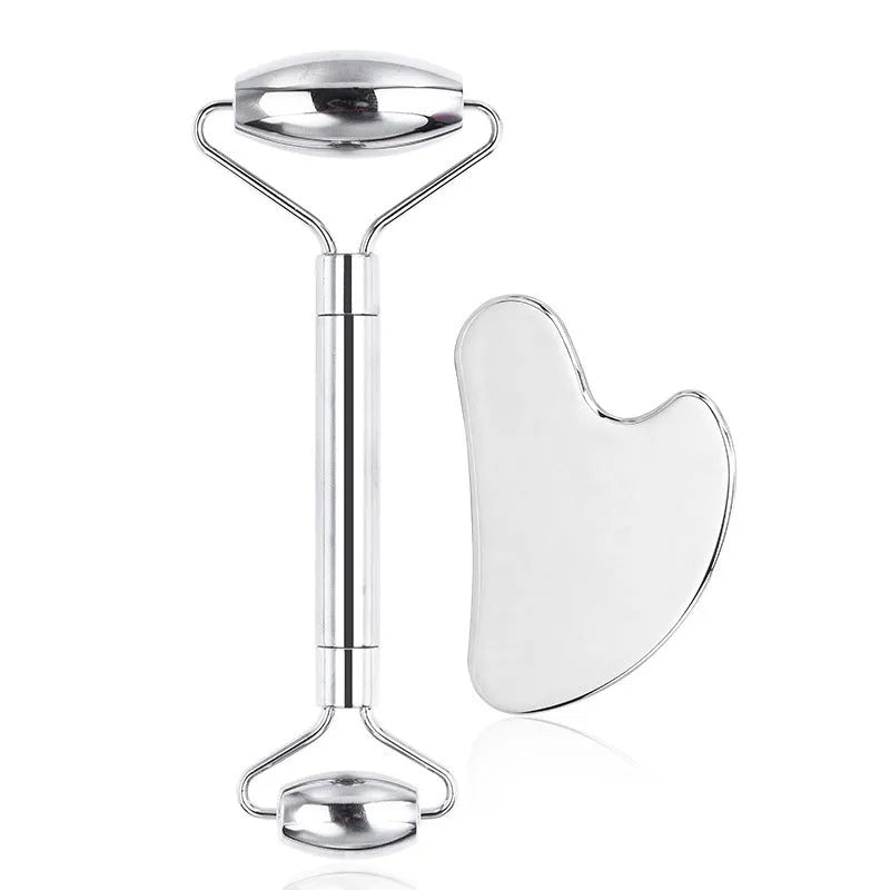 Stainless steel double-headed facial roller and gua sha scraping plate set with heart-shaped eye tool.