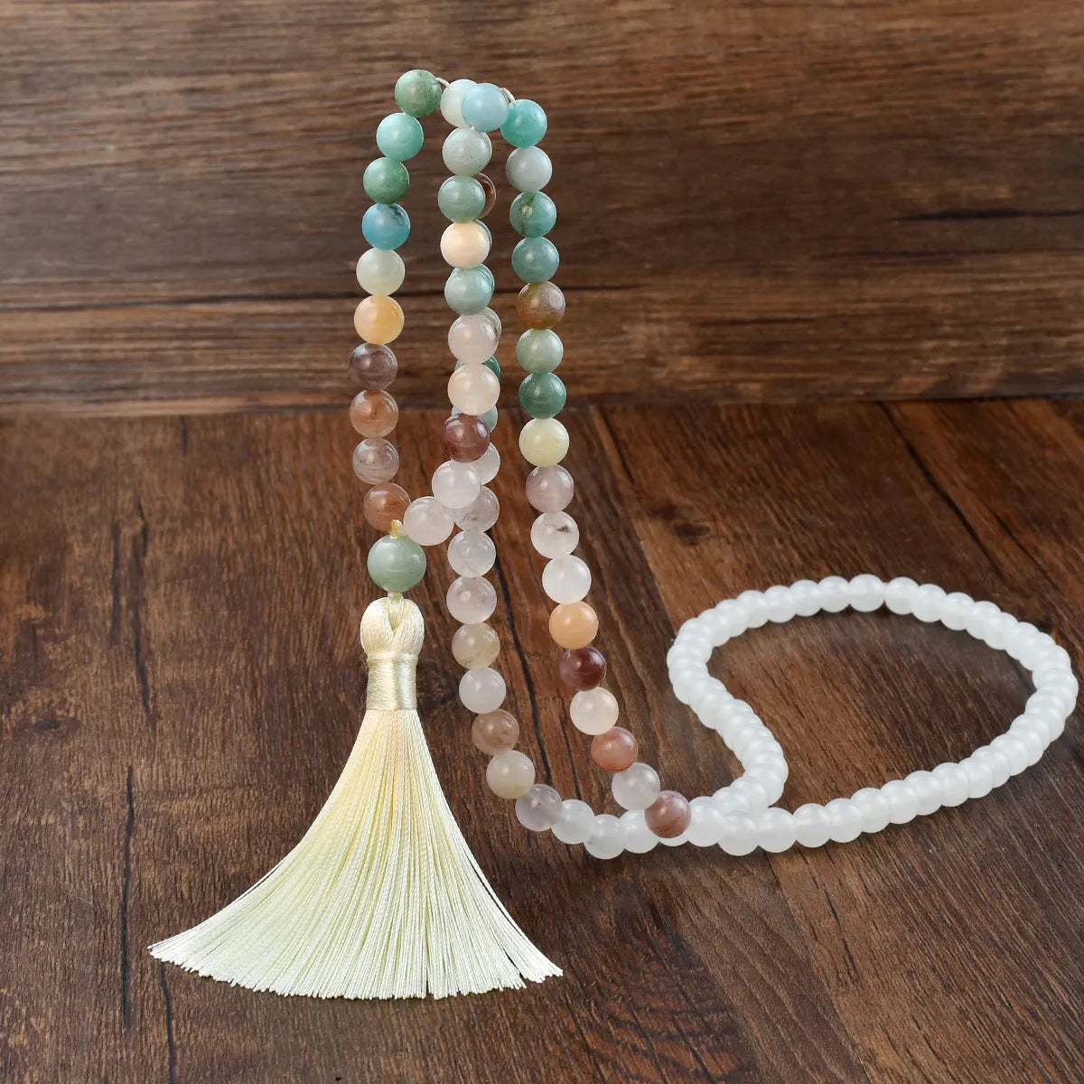 Handmade long beaded necklace with gemstone pendant and tassel, showing 81cm+ length.