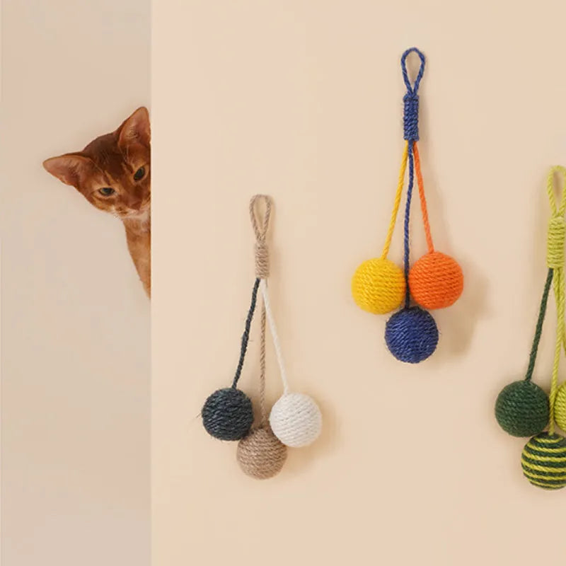 Bite-resistant cat teaser stick with wire core and three attached colourful catnip balls.