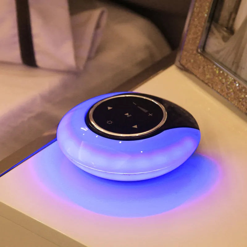 Blue Bluetooth speaker desk lamp with folding design and touch controls showing white, yellow and blue LED lighting