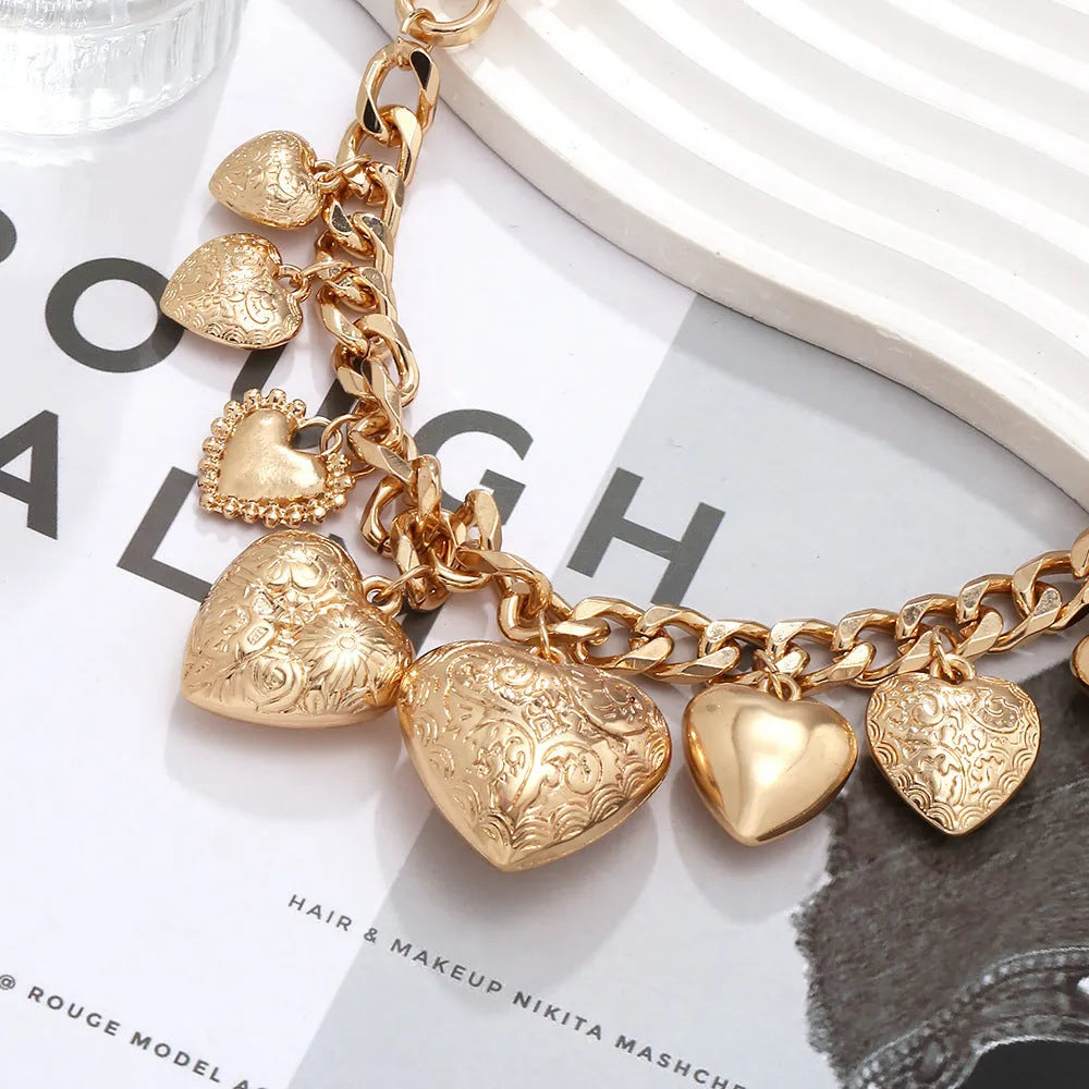 Carved heart pendant necklace in gold colour with adjustable chain length