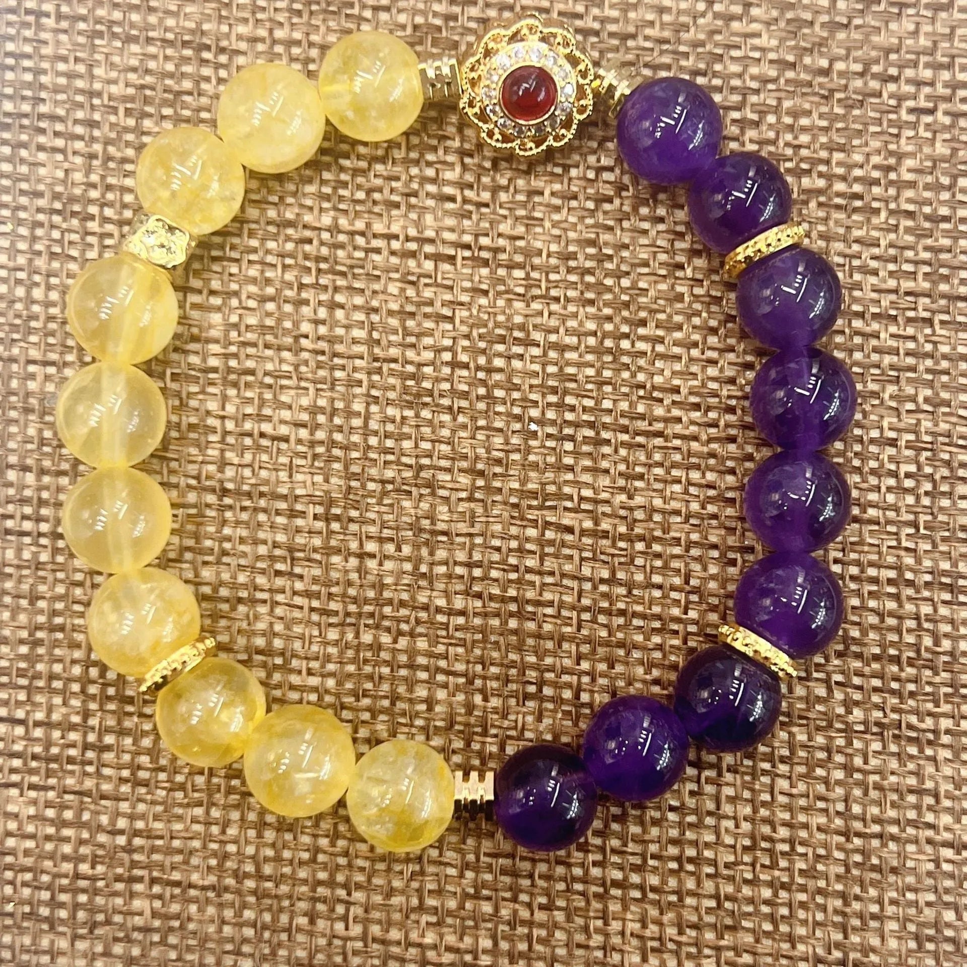 Handmade women's yellow and purple amethyst crystal bracelet with handcrafted details