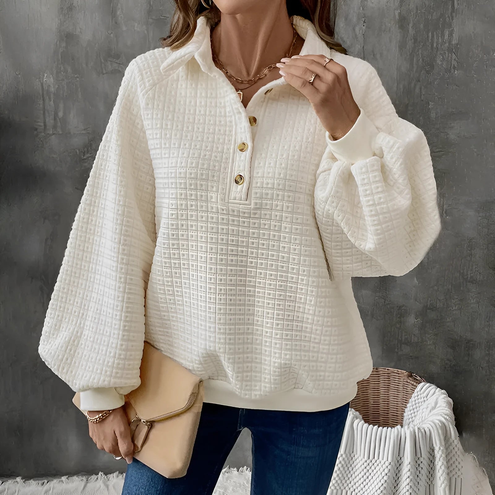 Women's milky white polo collar sweater with long sleeves and textured knit.
