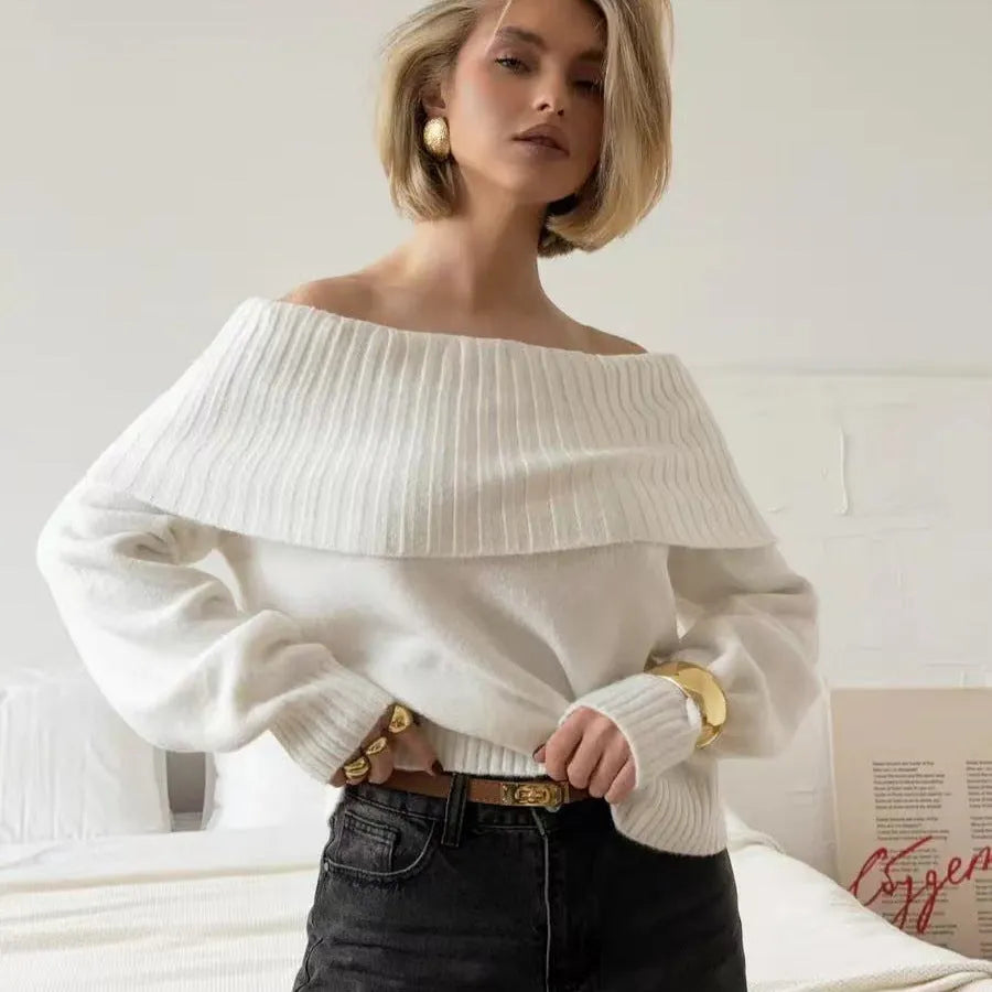 Grey off-the-shoulder strapless pullover sweater with a 3D pattern texture.