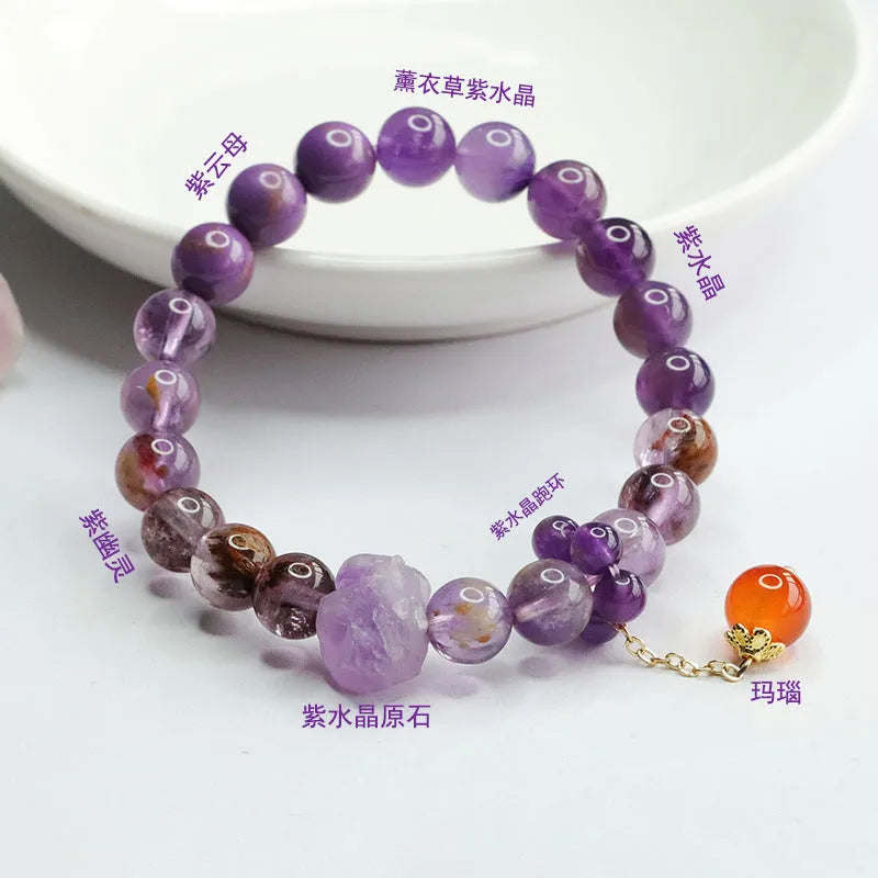 Close-up of a nine purple Fire Duobao and amethyst crystal bracelet with red agate stones, Mori style.