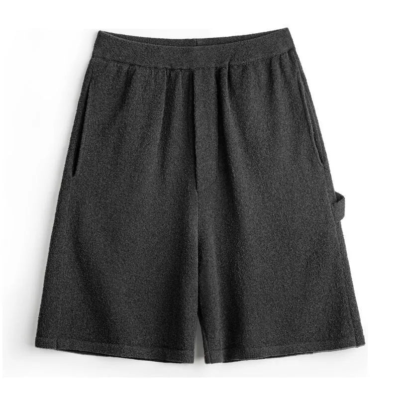 Cement grey American-style loose fit straight leg sports shorts made from heavy polyester fabric.