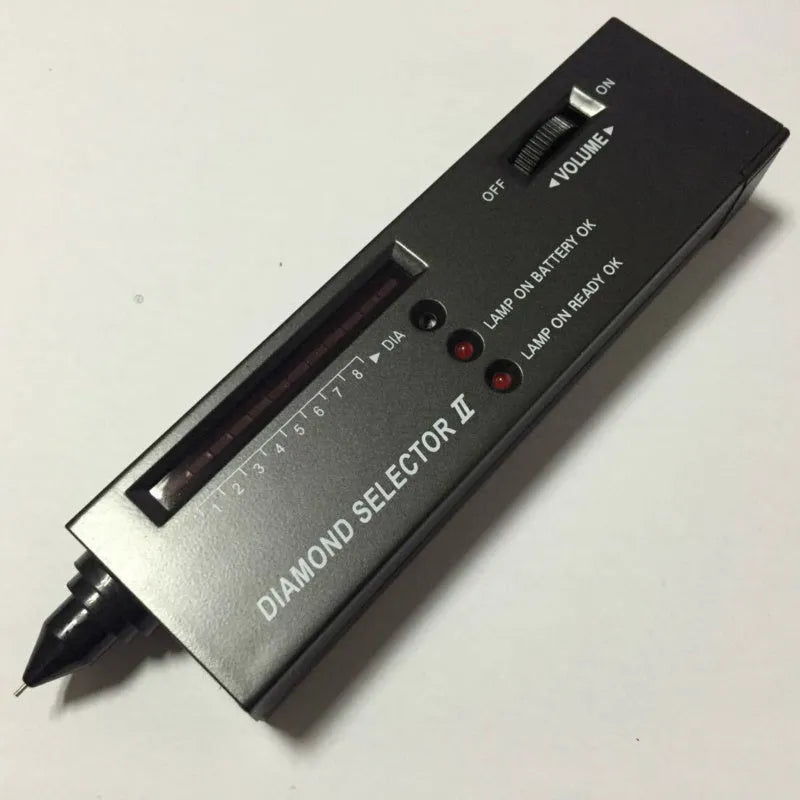 Black portable thermal conductivity meter for diamond testing with metal probe, showing dimensions.